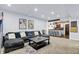 Finished basement offers a spacious living room with a wet bar and comfortable seating at 564 Gainesway N Dr, Greenwood, IN 46142