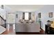 Comfortable living room featuring hardwood floors, stylish decor, and an abundance of natural light at 564 Gainesway N Dr, Greenwood, IN 46142