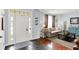 Inviting living room featuring hardwood floors, comfortable seating, and ample natural light at 564 Gainesway N Dr, Greenwood, IN 46142