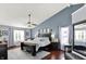 Spacious main bedroom featuring a vaulted ceiling, ceiling fan, and modern decor at 564 Gainesway N Dr, Greenwood, IN 46142