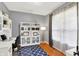 Bright office featuring shelving, hardwood floors and a comfortable workspace at 564 Gainesway N Dr, Greenwood, IN 46142