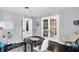 Inviting playroom features a round table with chairs and abundant natural light through French doors at 564 Gainesway N Dr, Greenwood, IN 46142