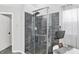Modern shower with sleek tiling, glass enclosure, and built-in shelving at 564 Gainesway N Dr, Greenwood, IN 46142