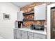 Wet bar features brick accent wall, wood accents, shaker cabinets and plenty of storage at 564 Gainesway N Dr, Greenwood, IN 46142