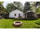 Backyard featuring a wood deck, screened in porch, and fire pit at 5736 Primrose Ave, Indianapolis, IN 46220