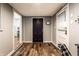 Inviting entryway with hardwood floors and a view into other rooms of the home at 5736 Primrose Ave, Indianapolis, IN 46220