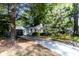 Charming single-story home with a black garage door and a concrete driveway at 5736 Primrose Ave, Indianapolis, IN 46220