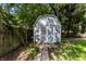 A charming shed is nestled at the back of this lovely, tree-filled property at 5736 Primrose Ave, Indianapolis, IN 46220