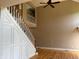 Elegant staircase with white railings and wood accents, leading to the second floor at 5775 Coopers Hawk Dr, Carmel, IN 46033