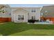 Well-manicured backyard with a spacious patio, green lawn, and outdoor dining area at 5809 Terracotta Trce, McCordsville, IN 46055