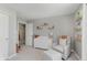 Comfortable Bedroom showcasing a rocking chair, dresser, and a cozy reading nook at 5809 Terracotta Trce, McCordsville, IN 46055