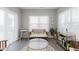 Bright living area with natural light, minimalist decor, and a comfortable seating arrangement at 5809 Terracotta Trce, McCordsville, IN 46055