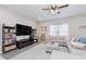 Inviting living room featuring a large sectional sofa, a wall-mounted TV, and stylish decor at 5809 Terracotta Trce, McCordsville, IN 46055