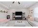 Well-lit living room with plush seating, entertainment center, and modern decor, offering a cozy atmosphere at 5809 Terracotta Trce, McCordsville, IN 46055