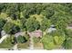 Aerial view of the home showcasing its large lot, mature trees, and neighborhood setting at 604 Oak Blvd W Dr, Greenfield, IN 46140