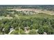 High angle shot showcasing the property's location among mature trees and community amenities at 604 Oak Blvd W Dr, Greenfield, IN 46140