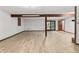 Spacious basement with new flooring and light-filled walkout door at 604 Oak Blvd W Dr, Greenfield, IN 46140
