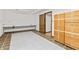 Basement area with work table, door, and built-in storage at 604 Oak Blvd W Dr, Greenfield, IN 46140