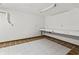 Unfinished basement with work table and painted white walls at 604 Oak Blvd W Dr, Greenfield, IN 46140