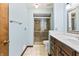 Bathroom featuring an updated vanity, mirror, and a glass-enclosed shower at 604 Oak Blvd W Dr, Greenfield, IN 46140