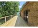 Spacious wood deck features access to the home and overlooks the private, wooded backyard at 604 Oak Blvd W Dr, Greenfield, IN 46140