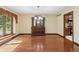 Dining room features hardwood floors, a chandelier, and a hutch next to a window at 604 Oak Blvd W Dr, Greenfield, IN 46140