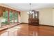 Dining room with hardwood floors and a view of the outdoors through a large window at 604 Oak Blvd W Dr, Greenfield, IN 46140