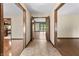 Inviting hallway with tile flooring and views into adjoining rooms, featuring hardwood floors at 604 Oak Blvd W Dr, Greenfield, IN 46140