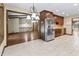 Bright kitchen with stainless steel appliances, and views into an open living space at 604 Oak Blvd W Dr, Greenfield, IN 46140