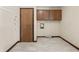 Bright laundry room with tile flooring, wall cabinets, and washer/dryer hookups for convenience at 604 Oak Blvd W Dr, Greenfield, IN 46140