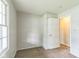 Comfortable bedroom with neutral carpet and paint, a large window and closet at 609 Willow Dr, Shelbyville, IN 46176