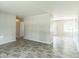 Spacious living area with gray walls and modern flooring leading to other rooms at 609 Willow Dr, Shelbyville, IN 46176