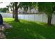 Spacious backyard with lush green grass and a white vinyl fence that ensures privacy and curb appeal at 6161 E Runnymede Ct, Camby, IN 46113