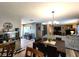 Open-concept dining area adjacent to the kitchen and living room, perfect for entertaining at 6161 E Runnymede Ct, Camby, IN 46113