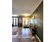 Inviting entrance features modern floors and a decorative tree at 6161 E Runnymede Ct, Camby, IN 46113