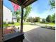 Inviting front porch view with an American flag, creating a warm and welcoming atmosphere at 6161 E Runnymede Ct, Camby, IN 46113