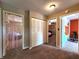 Hallway view of three rooms, including two bedrooms and an exercise room at 6161 E Runnymede Ct, Camby, IN 46113