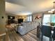 Spacious living room features modern floors, a fireplace, and a large sofa for comfortable living at 6161 E Runnymede Ct, Camby, IN 46113