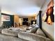 Spacious living room offers a fireplace, TV, modern floors, and comfortable seating at 6161 E Runnymede Ct, Camby, IN 46113