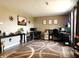 Spacious home office featuring a neutral palette, large windows and multiple workstations at 6161 E Runnymede Ct, Camby, IN 46113