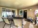 Enclosed patio featuring ample seating, sliding glass doors, and outdoor decor at 6161 E Runnymede Ct, Camby, IN 46113