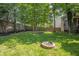 Well-maintained backyard features a fire pit and wooden fence at 6465 Robinsrock Dr, Indianapolis, IN 46268