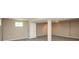 Spacious basement with neutral walls and carpet, featuring a support beam and plenty of room at 6465 Robinsrock Dr, Indianapolis, IN 46268
