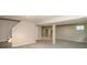 Spacious finished basement with neutral gray carpet and staircase visible at 6465 Robinsrock Dr, Indianapolis, IN 46268