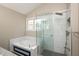 Bright bathroom featuring a shower with glass door and soaking tub, surrounded by elegant marble tiling at 6465 Robinsrock Dr, Indianapolis, IN 46268