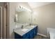 Bright primary bathroom features a double sink vanity with granite top, and modern fixtures at 6465 Robinsrock Dr, Indianapolis, IN 46268