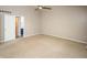 Spacious bedroom with carpet, ceiling fan and view of the ensuite bathroom at 6465 Robinsrock Dr, Indianapolis, IN 46268