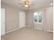 Well-lit bedroom with a ceiling fan and natural light from the window with sheer pink curtains at 6465 Robinsrock Dr, Indianapolis, IN 46268