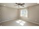Cozy bedroom with neutral carpet and a ceiling fan, offering comfort and functionality at 6465 Robinsrock Dr, Indianapolis, IN 46268