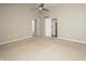 Large bedroom with doorways to the ensuite bathroom and a walk in closet at 6465 Robinsrock Dr, Indianapolis, IN 46268